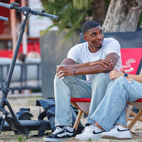 NIU Electric Scooter for Adults - Front Suspension, 600W Max Power, 18 Miles Range, Max Speed 17.4MPH, 9.5'' Pneumatic Tires, Dual Brakes, Easy Folding Portable Commuting Escooter, UL Certified